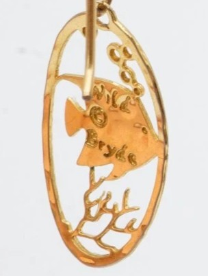 Close-up of the engraved Wild Bryde hallmark on the back of a pendant